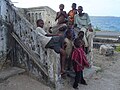 Boys posing for the camera near the bay at Mikindani.