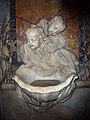 Holy water font in Santa Maria Maddalena, Rome, Italy