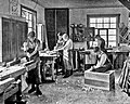 Image 57Students in a carpentry trade school learning woodworking skills, c. 1920 (from Vocational school)