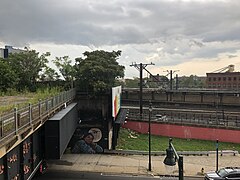 Footbridge and station entrance seen from the Commons