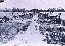 Village with a dirt road and closely-spaced houses