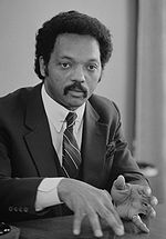Thumbnail for File:Jesse Jackson, half-length portrait of Jackson seated at a table, July 1, 1983 edit.jpg