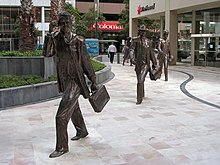 sculptures of office workers