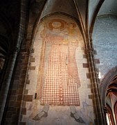 Fresque Saint Christophe tenant l'enfant Jésus dans ses bras (XIVe siècle).