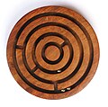 Image 30A ball-in-a-maze puzzle (from List of wooden toys)