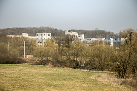 The bridge over the Savoureuse river, with the UTBM university in the background.