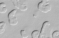 Close-up view of Swiss cheese terrain. Polygonal pattern was probably formed by shallow troughs.