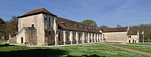 Photographie moderne du corps de bâtiments d'une abbaye.