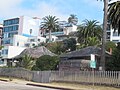 "Red Roost" and "Red Rest", two bungalow cottages built in 1894 on the road above La Jolla Cove. In recent years the cottages have been covered in tarpaulins