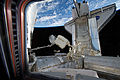 Dextre in the center as Station's Canadarm2 transfers AMS-02 for installation