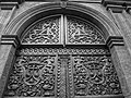 Antique, hand carved wooden door to a Church in the Historic Center of Quito