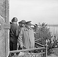 Winston Churchill with American generals on a balcony watching Allied vehicles crossing the Rhine. 25 March 1945