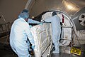 Technicians move the zero-g storage rack into Leonardo