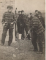 Charlie Hunter (left) watches as Old Tom Morris plays a shot in 1863 at Prestwick. Both of the players are wearing the traditional tweeds.