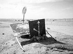 Important old sign 95km south of Tamanrasset on the main southbound In Guezzam route, indicating the fork heading ESE for I-n Azaoua well.