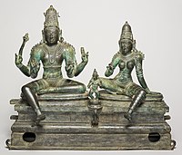 Shiva and Uma with different pendent legs, late Chola bronze, c. 1400
