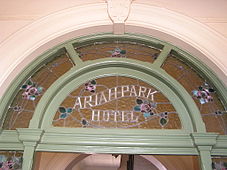 This domestic leadlighting above the residential entrance of a 19th-century Australian hotel shows a use of opaque glass which allows the name to be visible both by day and night.