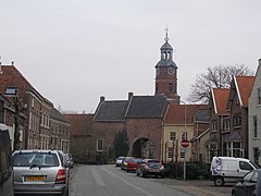 The Culemborg gate with the Saint-Lambertus church, Buren in the background.