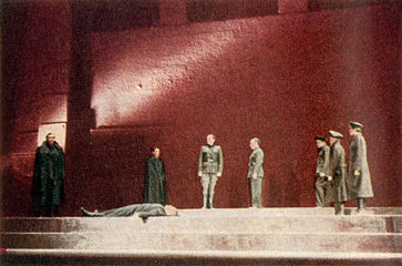 Standing over the murdered body of Caesar, Brutus (Orson Welles) is confronted by Marc Antony (George Coulouris) and Cassius (Martin Gabel)