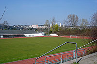 Association football pitch, surrounded by running track