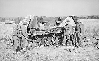 Men of the 6th Airborne Division investigate a Marder I (H39 chassis) they had destroyed