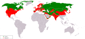 Suden levinneisyys koiraa lukuun ottamatta, nykyinen levinneisyys vihreällä ja historiallinen levinneisyys punaisella.