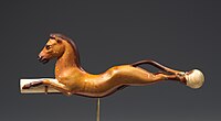 The horse was probably introduced to Egypt by the Hyksos, and became a favourite subject of Egyptian art, as in this whip handle from the reign of Amenhotep III (1390–1353 BC).[180]