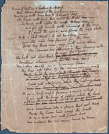 A white sheet of paper that is completely filled with a poem in cursive hand writing. Many of the lines mid-way down the page are scratched out.