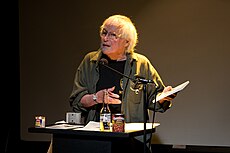 David Meltzer prednáša v roku 2007 na „Beyond Baroque Literary Arts Center, Los Angeles.“
