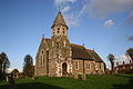 St John the Baptist's Church, High Toynton, Lincolnshire, 1872 by Ewan Christian, showing the unusual south-west porch tower with broaches to the octagonal upper storey and topped by a short spire[166]