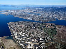 Aerial view of Bay Farm Island. Toward the bottom of the image are mostly office and warehouse buildings.