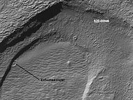 Crater that was buried in another age and is now being exposed by erosion, as seen by the Mars Global Surveyor under the MOC Public Targeting Program. Image is located in the Noachis quadrangle.