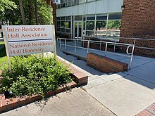 A building and separate sign reading "Inter-Residence Hall Association" and "National Residence Hall Honorary"