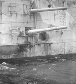 Casemate guns on HMS Kent showing shell damage from the Battle of the Falkland Islands