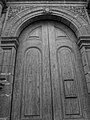 Antique, hand carved wooden door to a Church in the Historic Center of Quito