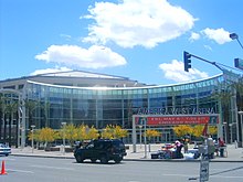 photo showing the semi-circular entrance to the America West Arena (now Talking Stick Arena) in downtown Phoenix, blue sky in background