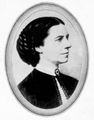 Clara Barton circa 1875. Miss Barton had the original of this image retouched and added the German Red Cross Field Badge shown on her collar.