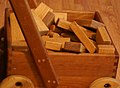 Image 23Wooden unit blocks, a type of toy block, in a wooden wagon (from List of wooden toys)