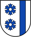 Silberne Butzen in zwei blauen Kornblumen im Wappen der Gemeinde Langenberg (Kreis Gütersloh)