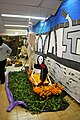 Cardboard figures on a boat associated with the canals of Xochimilco on display for Day of the Dead at the Library/Museum