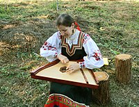 The Gusli instrument was first recorded in 12th century in Novgordian Rus'.