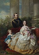 1862年のフリードリヒ皇太子一家を描いた絵。母ヴィクトリアの左に座っているのがヴィルヘルム。母の膝の上にいるのは妹のシャルロッテ。