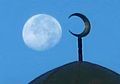 The Moon behind the crescent symbol of a mosque (Nakhchivan, Azerbaijan)