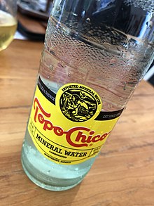 A glass bottle of Topo Chico