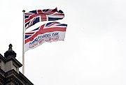 armed forces flag flies underneath the flag of the United Kingdom