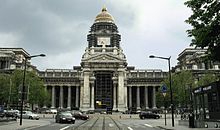 Building with central cupola and wings with Greek-style columns