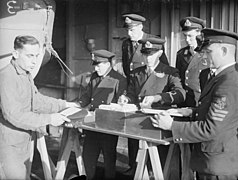 Pay Day on Board the Battleship, HMS Howe. November 1942. A12528.jpg