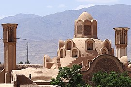 The dome of the talar and the two windcatchers on the house's roof.