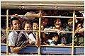 A songthaew loaded with young students on the way home from school. Amphoe Kantharalak (Jan 2005)