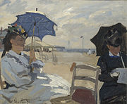 Plaža v Trouvillu, 1870, National Gallery, London. The left figure may be Camille, on the right possibly the wife of Eugène Boudin, whose beach scenes influenced Monet.[31]